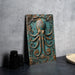 a picture of an octopus in a frame on a table