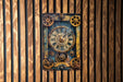 a clock that is on the side of a wooden wall