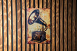 a painting of a record player on a wooden wall