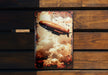 a book with a picture of an airplane flying in the sky