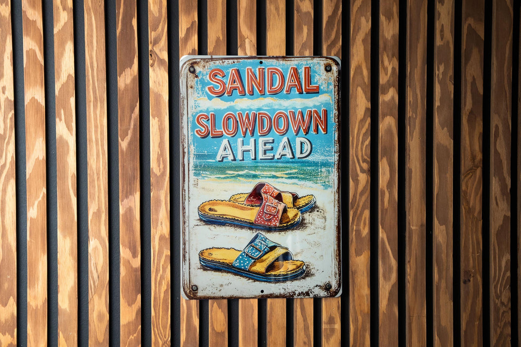 a sign on a wooden wall that says sandal slowdown ahead