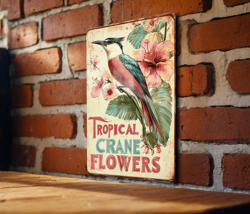a sign on a brick wall that says tropical cranee's flowers