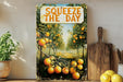 a painting of oranges hanging on a wall