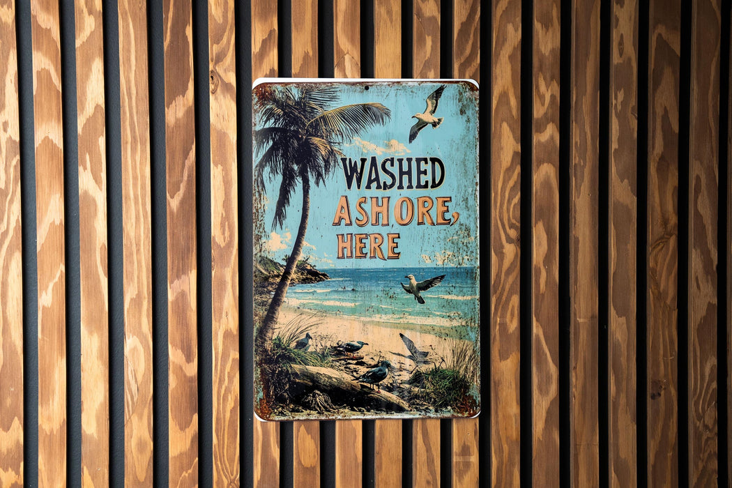 a sign on a wooden wall that says washed ashore here