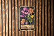 a sign on a wooden wall that says petal - dyed writing well