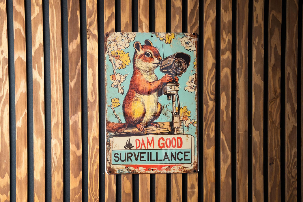 a sign on a wooden wall that says dan good surveillance