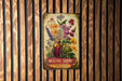 a picture of a painting of flowers on a wooden wall