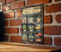 a vintage veggie vault sign on a brick wall