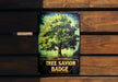 a tree savor badge hanging on a wooden wall