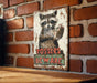 a picture of a raccoon on a brick wall