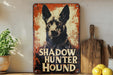a picture of a black dog on a rusted metal sign