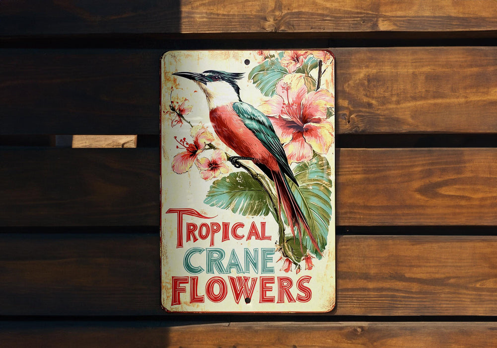 a metal sign with a bird and flowers on it