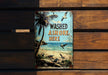 a sign on a wooden bench that says washed ashore here