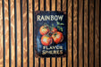 a sign on a wooden wall that says rainbow flavored tomatoes