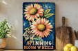 a painting of flowers on a shelf next to a potted plant