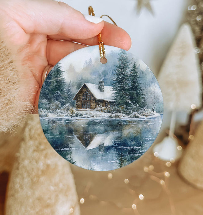 a person holding a christmas ornament in their hand