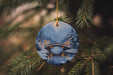 a christmas ornament hanging from a christmas tree