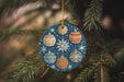 a christmas ornament hanging from a christmas tree