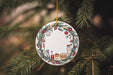 a christmas ornament hanging from a christmas tree