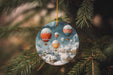 a glass ornament hanging from a christmas tree