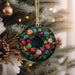 a christmas ornament hanging from a christmas tree