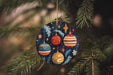 a christmas ornament hanging from a christmas tree