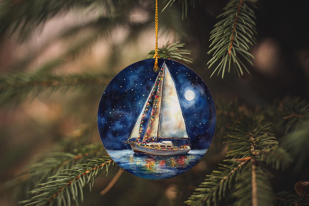 a sailboat ornament hanging from a christmas tree