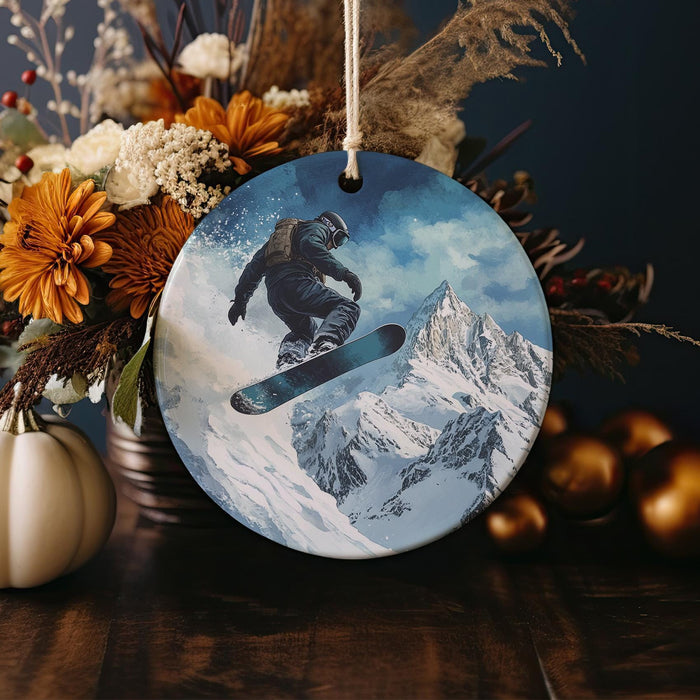 a christmas ornament with a snowboarder on it