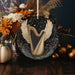 a decorated christmas ornament with a golden harp