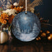 a christmas ornament with a winter scene on it