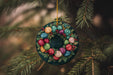 a christmas ornament hanging from a tree