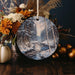 a christmas ornament with a winter scene on it