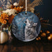 a ceramic ornament with a wolf on it