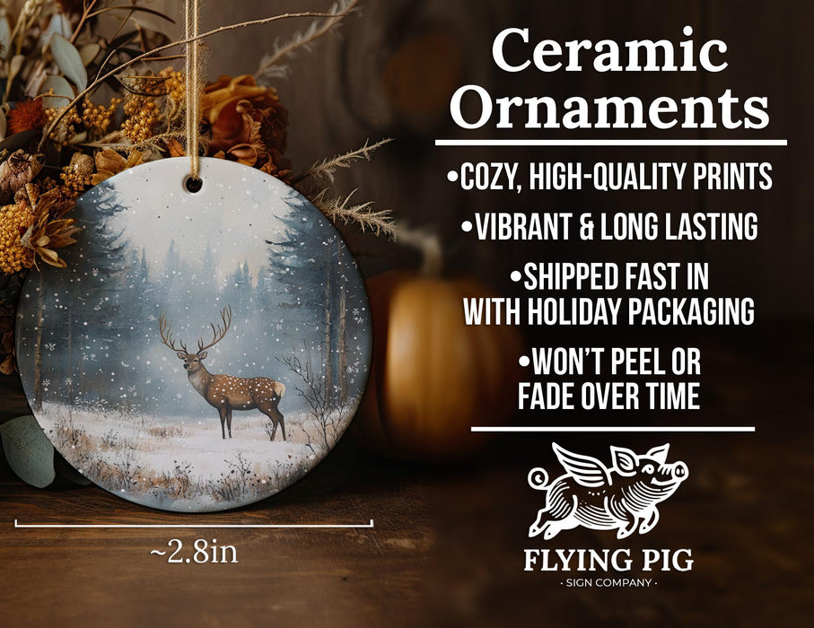 a ceramic ornament with a deer in a snowy forest