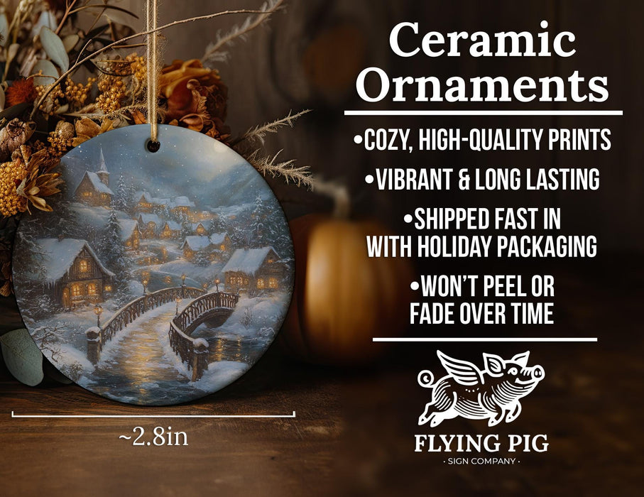 a ceramic ornament with a picture of a town on it