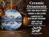 a ceramic ornament with a mountain scene on it