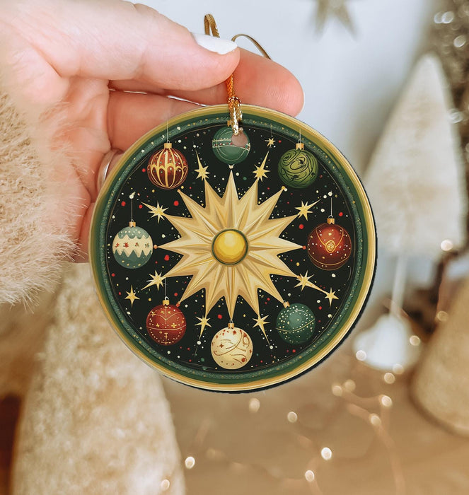 a person holding a christmas ornament in their hand