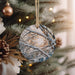 a close up of a christmas tree with ornaments