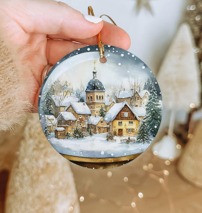 a person holding a christmas ornament in their hand