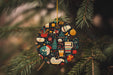 a christmas ornament hanging from a christmas tree