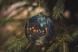 a christmas ornament hanging from a christmas tree