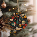 a christmas ornament hanging from a christmas tree
