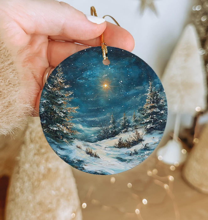 a person holding a christmas ornament in their hand