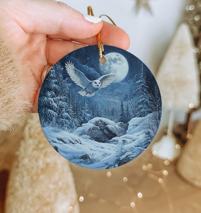 a person holding a christmas ornament in their hand