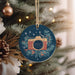 a christmas ornament hanging from a christmas tree