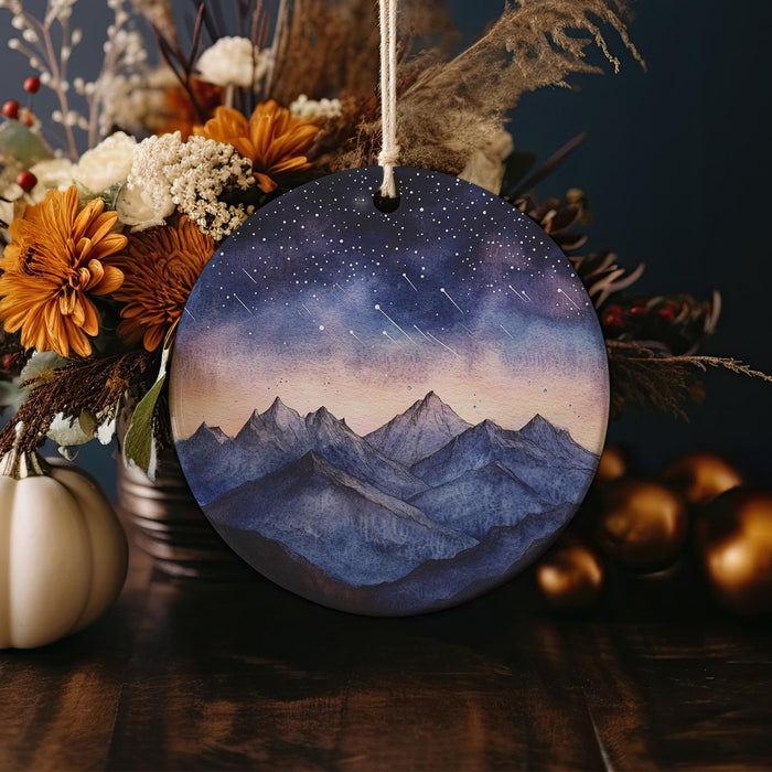 a picture of a mountain range with stars in the sky