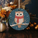 a ceramic ornament with an owl wearing a scarf