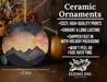 a ceramic ornament with a mountain scene on it