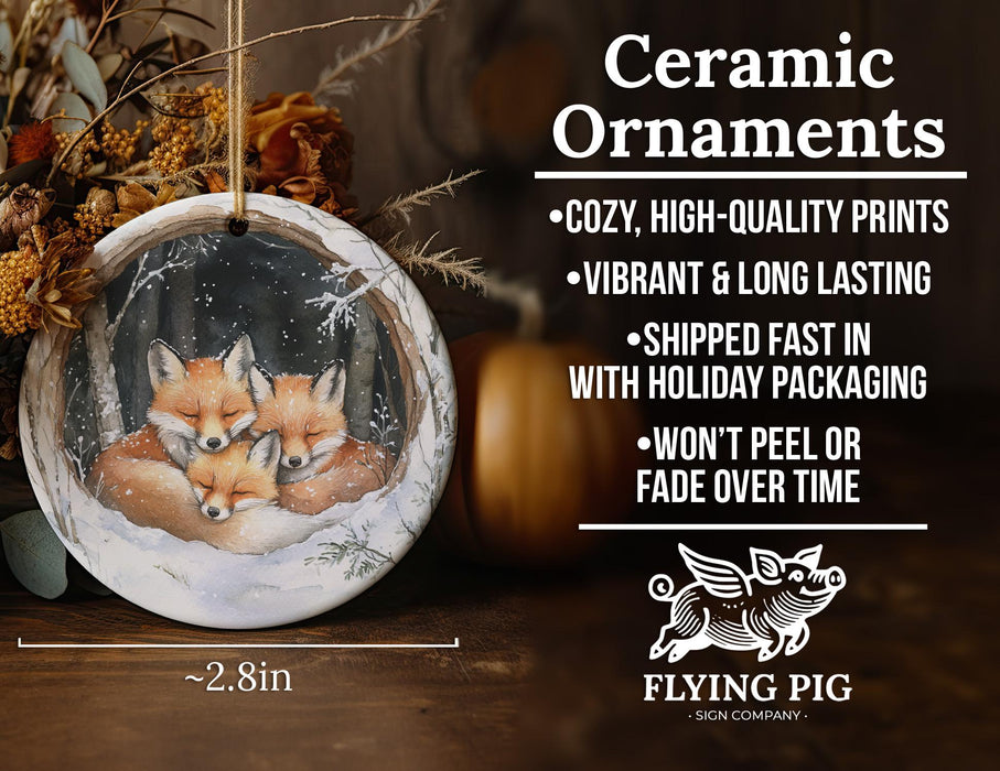 a ceramic ornament with two foxes on it