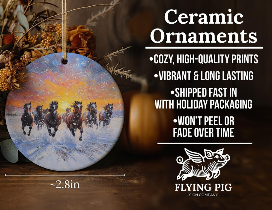 a ceramic ornament with a painting of horses running in the snow